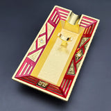 Red and gold Art Deco metal cigar ashtray with decorative geometric pattern
