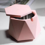 pink hexagon ashtray open lid showing cigarette holder groove