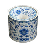 Ceramic ashtray with blue floral patterns on a white background