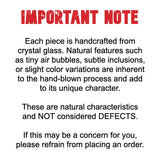 Text explaining that each piece of crystal glass is handcrafted with natural characteristics, not considered defects.