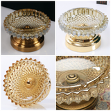 Top view detail of faceted glass ashtray with gold tone base