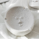 Wonder face expression ceramic ashtray in white, unique sculptural design