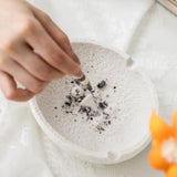 Face expression ceramic ashtray in use, easy-clean white ceramic design