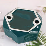 Bottom part of a hexagonal emerald green ceramic ashtray
