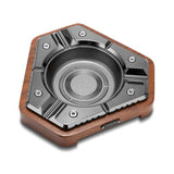 Glossy black hexagon cigar ashtray with wood base on a white background