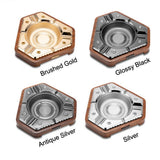 Four color options of the modern hexagon cigar ashtray including gold, black, antique silver, and silver