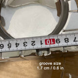 Close-up of groove size on modern silver cube ashtray, 1.7 cm rest for cigarettes and cigars