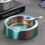 Multicolored stainless steel metal ashtray with a lit cigarette
