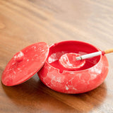 red marble look ashtray with lid open cigarette holder grooves ceramic design