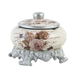 Vintage floral ceramic ashtray with lid and ornate silver stand for outdoor and tabletop use