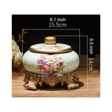 Large floral ceramic ashtray with lid dimensions 6.1 inches wide and 5.5 inches tall