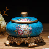 Turquoise vintage floral ceramic ashtray with lid and ornate bronze base