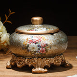 Brown floral ceramic ashtray with lid and ornate bronze base
