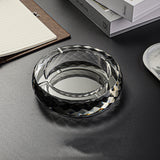 Black glass ashtray round design on desk minimalist setting